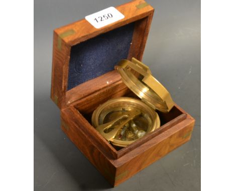 A reproduction brass compass, Stanley London, treen hinged case
