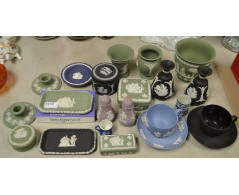 A pair of Wedgwood black Jasperware bottle vases; a similar cylindrical trinket pot and cover; a black basalt tea cup and sau