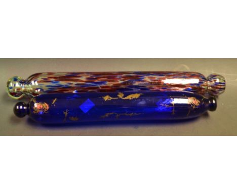 A Nailsea type multi coloured glass rolling pin, another Bristol blue (2)