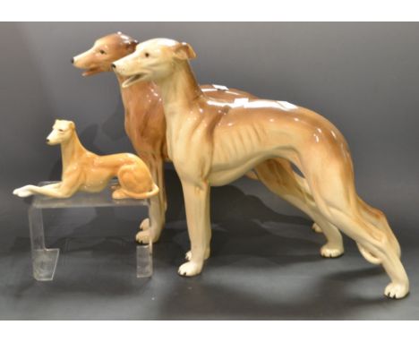 Ceramics- a Melba model Greyhound standing; another; a smaller seated (3) 