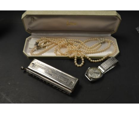 A gent's stainless steel Rotary wristwatch, c.1980; a doulbe strand of Lotus simulated pearls; a Hohner harmonica; a Royal Ma