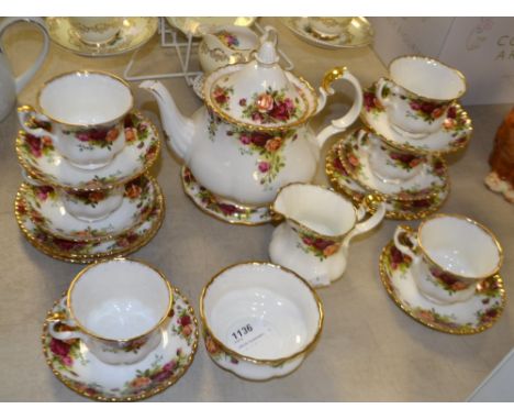 A Royal Albert Old Country Roses six-setting tea service, comprising teapot and stand, sugar and cream, six teacups and sauce