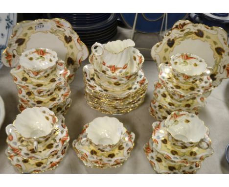 A Radford pottery tea service for for twelve including sugar bowl, two cake plates, mill jug, cups, saucers etc, decorated wi