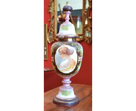 A 19th century continental opaque white glass pedestal vase and cover, printed and painted, the central cartouche with a port