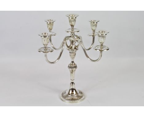 A silver plated five-light scroll arm candelabra, 34.5cm high