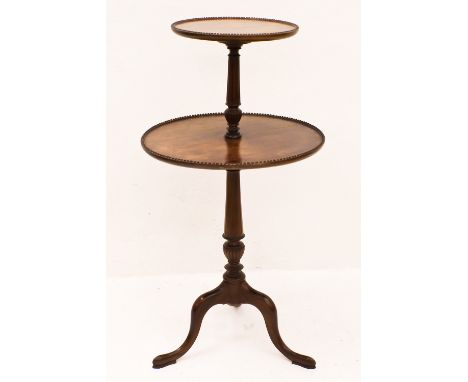 A Victorian mahogany two-tier dumb waiter, the circular tiers with beaded edges, on a tripod base, 47cm diameter and 91cm hig