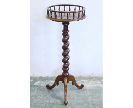 A walnut tripod plant stand with turned spindle gallery top, on barley twist stem, 82cm high