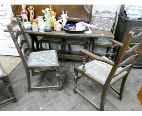 An oak refectory style dining room table with a set of four oak ladder back dining room chairs with tapestry seats and a pair