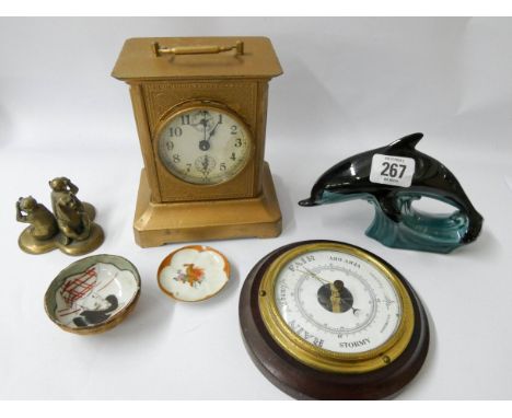 Metal carriage clock, small barometer, Poole dolphin ornament and other pieces