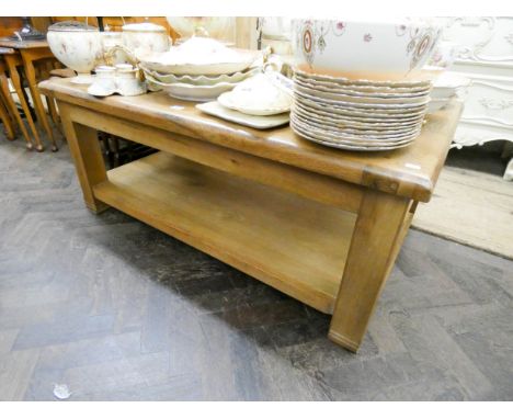 A contemporary chunky light oak two tier rectangular coffee table 