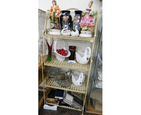 A four tier folding cream metal shelf unit 