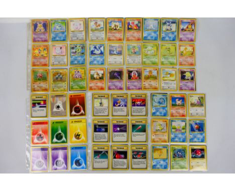 Pokemon - A very near complete set of Pokemon 'Base Set' trading cards. Lot includes cards such as #4 Charizard; #12 Ninetale