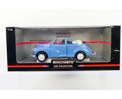 Minichamps - A boxed 1:18 scale Minichamps #150 137030 Morris Minor Convertible. The model in blue appears to be in Mint cond