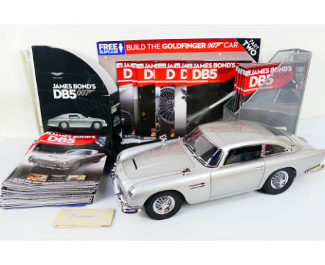 Eaglemoss - A constructed Eaglemoss 1:8 scale Aston Martin DB5. The model appears to be in Mint condition and comes with cove