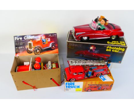 QSH - Vintage Tinplate - 3 x boxed vehicles, a battery operated Fire Chief car, a friction Fire Truck and a battery powered P