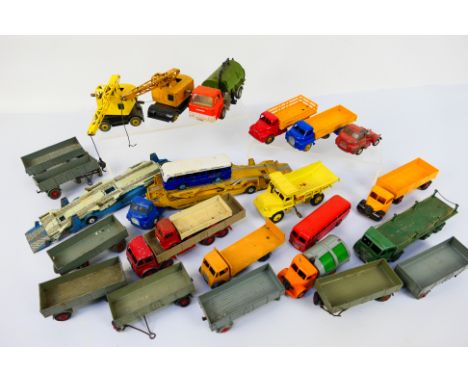 Dinky Toys - Corgi Toys - An unboxed group of playworn and mostly restored diecast model vehicles; including Dinky Toys #531 