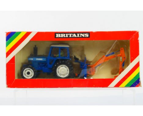 Britains - Farming. A boxed Britains #9598 1/32 scale Ford 7710 tractor and rear digger. Item appears in Excellent condition 