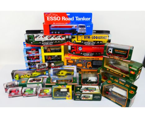 Corgi - Eddie Stobart - Realtoy - Action City - Esso Collection - Simba. A selection of Twenty-Five boxed diecast models and 