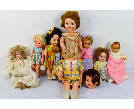 Pedigree - Others - A collection of nine unboxed vintage and modern hard plastic and vinyl dolls. Lots includes an unmarked v