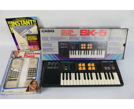 Casio - SK5 - Bluebox - Intercom Phone. A boxed Casio SK-5 Sampling Keyboard appearing as new with VG box with some scuffing.