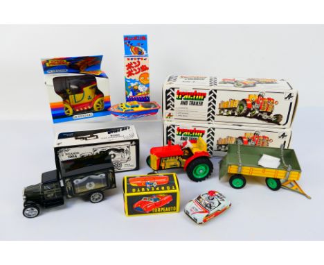 Kovap - Dubena - Vintage Tinplate - A collection of boxed tinplate vehicles including 2 x tractors with trailers, a candle po