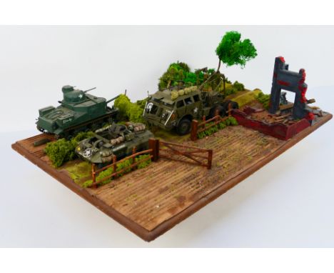 Tamiya - A WWII diorama created using Tamiya 1:35 scale model kits, this battle scene constructed on a wooden base features a