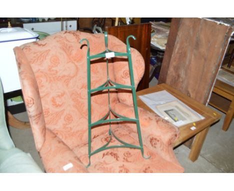 A metal four tier pot stand 