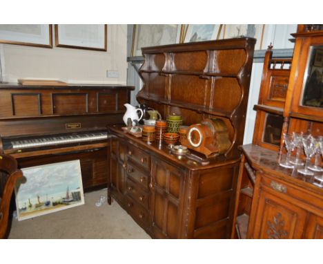 An Ercol dresser fitted four drawers below