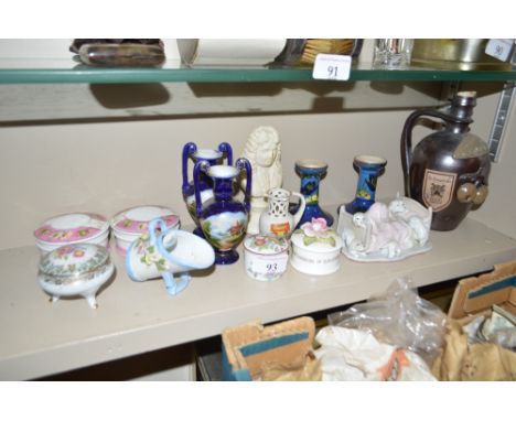 A quantity of miniature china items to include small trinket boxes; a crested jug; a continental stoneware jug; a Fairings or