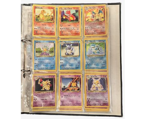 A folder containing 152 Pokemon cards from 1999 Base Set, Jungle and Base Set 2. Including a Holo Charizard (4/102) card in p