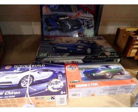 Four model car plastic kits, Airfix Bugatti Chiron and E type Jag, Revell New Type Beetle and Revell Pixar Cars Jackson Storm