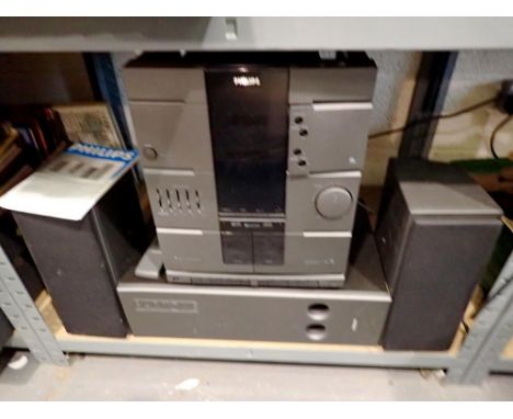 Philips FW2012 stereo with subwoofer radio/CD/twin cassette decks, working. All electrical items in this lot have been PAT te