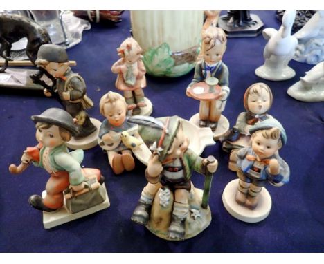 Eight Hummel figures all with damages. UK P&amp;P Group 3 (£30+VAT for the first lot and £8+VAT for subsequent lots) 