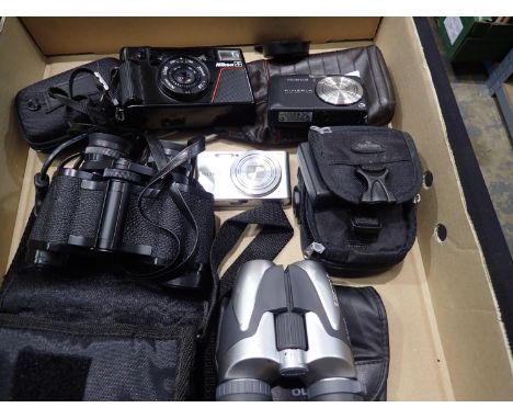 Sony Cybershot digital camera with a Fujifilm F50FD, a Nikon AF camera, pair of Olympus binoculars and a pair of Halina binoc