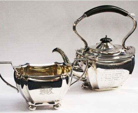 An Edwardian four piece silver teaset, comprising teapot, sugar and milk and matching spirit kettle (lacking stand and burner