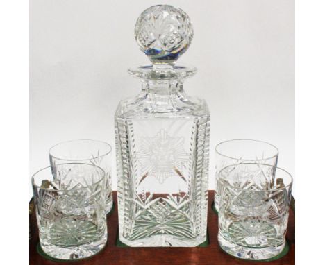 A glass decanter and four matching tumblers on a wooden tray style stand, each bearing crest for Derbyshire Fire Service

Don