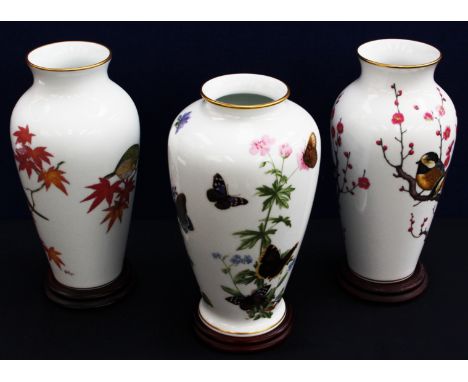 Three Franklin porcelain vases comprising a pair of Japanese style vases and one Meadow land Butterfly vase by John Wilkinson