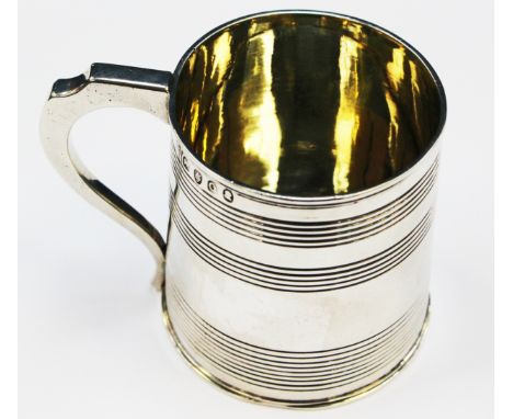 A George III silver christening mug, cylindrical form with concentric ring decoration, makers SG, EW & ?R, London 1811, 79.7 