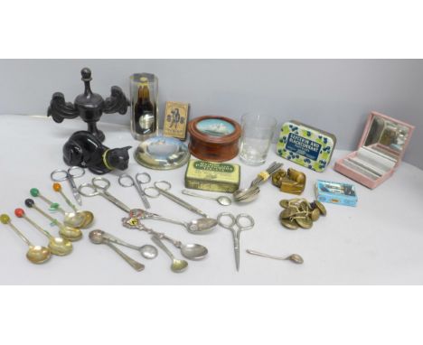 A box of assorted items including a box with ship detail to the top, advertising tins, Guinness paperweights, a netsuke with 