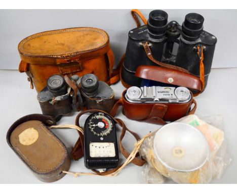 Two pairs of binoculars, a Voigtlander Vito II camera and a light meter