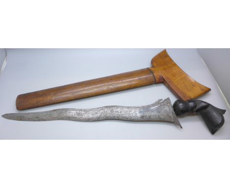 An Indonesian Keris/Kris dagger in a hardwood sheath *THIS LOT IS NOT AVAILABLE FOR PACKING AND POSTING 