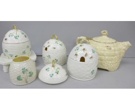 Collection of three Belleek cream glazed porcelain honey pots, extra lid and another smaller pot, to include 3rd and 6th mark