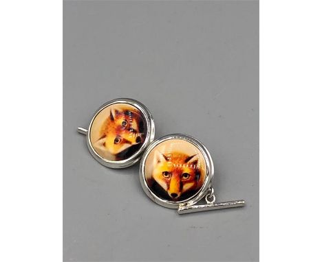 A Pair of silver and enamel cufflinks depicting a Fox.