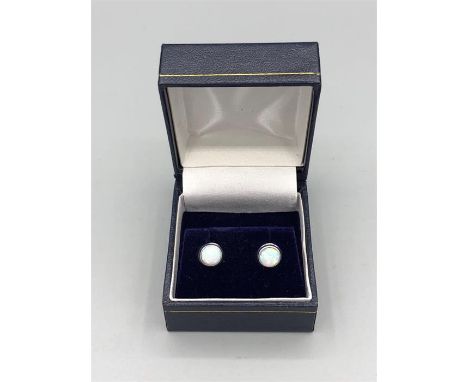 A Pair of silver and opal stud earrings