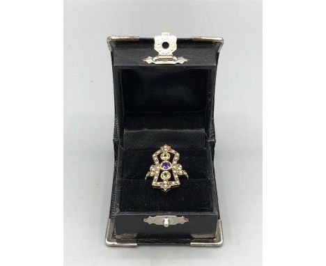 A 9ct yellow gold Art Deco style ring inset with Peridot, Amethyst and Seed Pearls