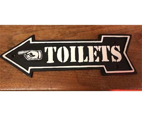 A cast iron Toilet arrow sign