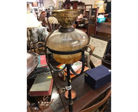 A Wrought Iron oil lamp, converted...