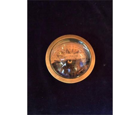 A Navigating compass with magnifier