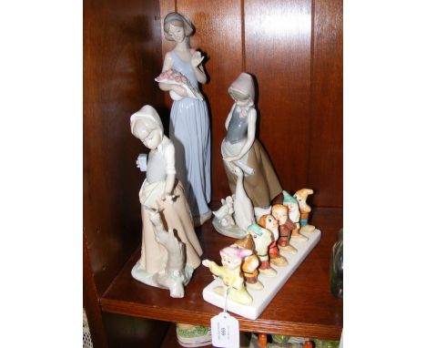 Lladro and Nao figurines, together with Snow White and The Seven Dwarfs ceramic toast rack 