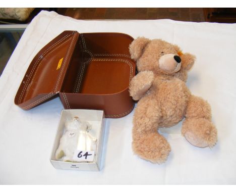 A small Steiff Bear in travelling case, together with a miniature Steiff Bear - boxed 